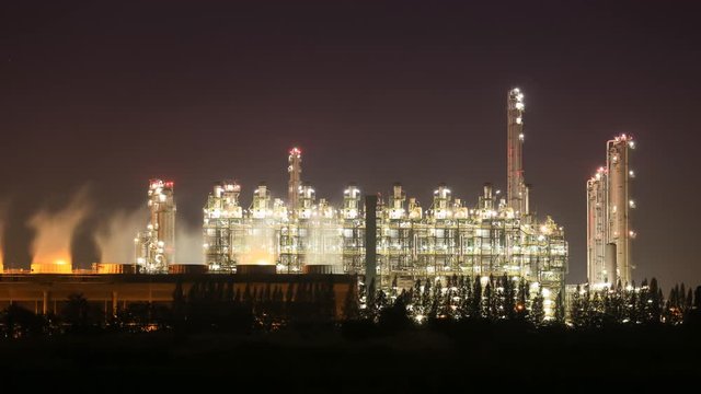 4k Time-lapse of Oil refinery industrial plant with sky at night, Thailand