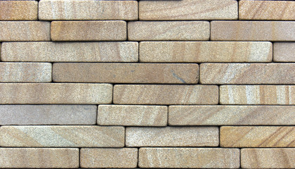 Wall of Indian sandstone, with a beautiful structure, decorative building, facing material