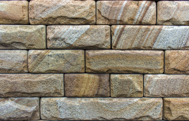 Wall of Indian sandstone, with a beautiful structure, decorative building, facing material