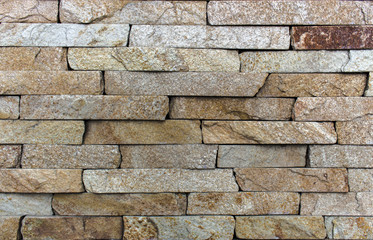 Wall of Indian sandstone, with a beautiful structure, decorative building, facing material