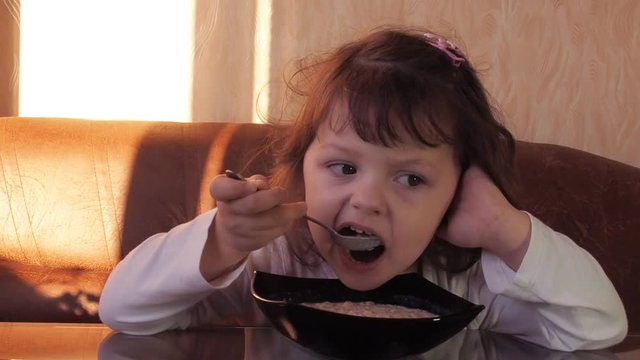 Child eats porridge