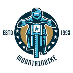 Logo mountain bike. A cyclist coming down the mountain. Extreme sport. Danger, downhill. Front view, helmet, goggles. Vector illustration. Flat style
