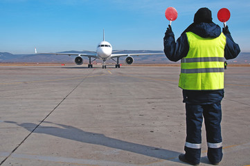 Airport worker directing