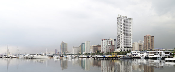 Landscape of Manila embankment, houses and sea