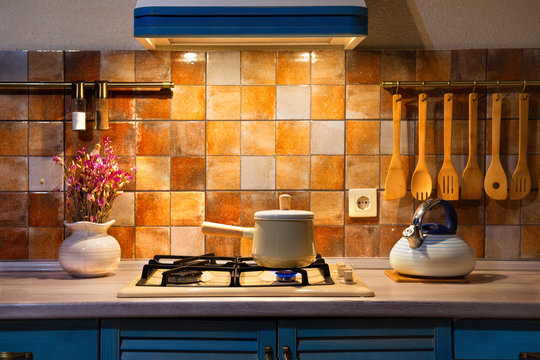 New pan with wooden handle on the stove.