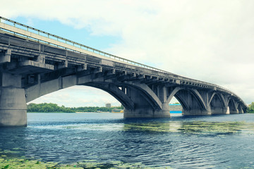 Naklejka na ściany i meble Concrete bridge over river
