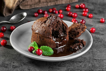 Chocolate fondant with berries on plate