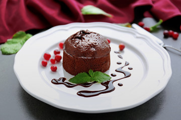 Chocolate fondant with berries on plate
