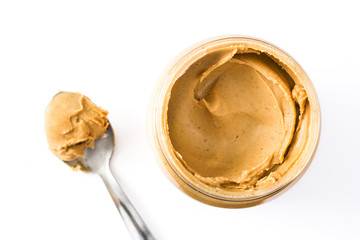 Creamy peanut butter and spoon isolated on white background
