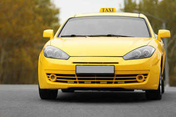 Yellow car with taxi sign on roof, outdoor