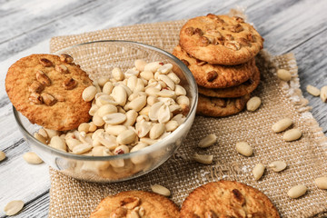 Peanut cookies on napkin on wooden background