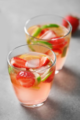 Fototapeta na wymiar Two glasses of strawberry cocktail, closeup