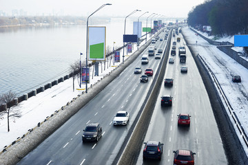 View of city road with cars in winter