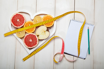 diet plan and centimeter on a white background