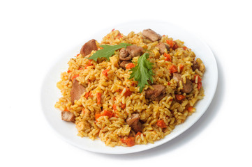 pilaf with meat and vegetables in a white plate