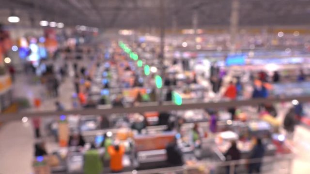 Blurred supermarket checkout area, view from above. 4K background bokeh video