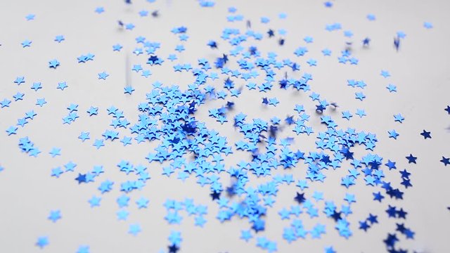 Christmas blue shiny stars konfetti are falling