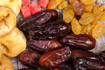 Dried fruits on wooden background in studio photo