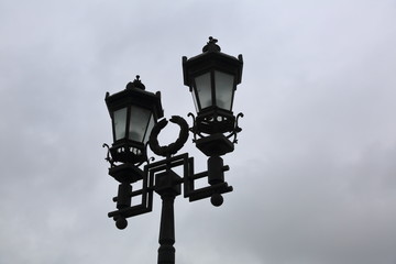 Fototapeta na wymiar Vintage black lantern on a city street