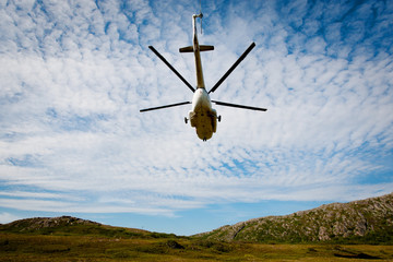 Passenger Helicopter flying in blue sky