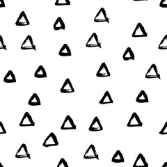 Seamless black and white vector free hand doodle texture with triangles, dry brush ink art.