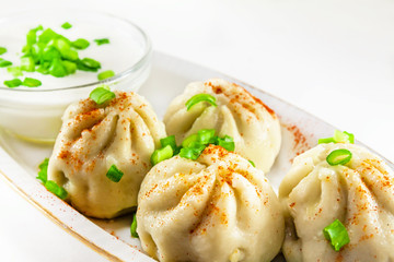 Georgian dumplings Khinkali with meat and green onion