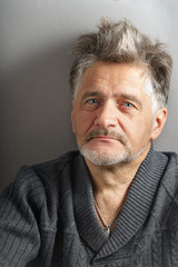 Portrait of the man at the age vertical