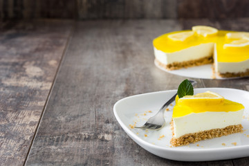 Lemon pie on wooden background

