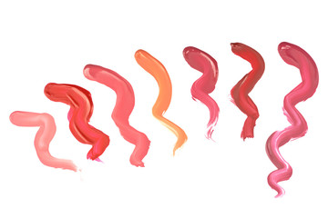 Several liquid lipstick different color strokes samples, isolated on white background
