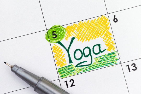 Reminder Yoga in calendar with pen