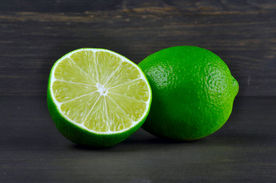 Lime on dark wood background