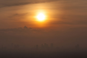Sunrise over downtown Bangkok, Thailand.  Silhouette cityscape.
