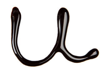 Small letter of alphabet made from chocolate syrup, isolated on  white