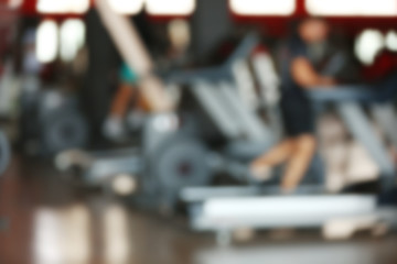 Gym interior with equipment, blurred background