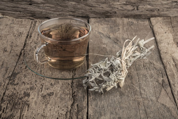 sage tea on wooden table