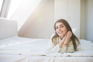 woman have fine on her bedroom. Young lady enjoying her morning and wake up.