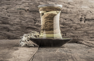 Naklejka premium sage tea on wooden table