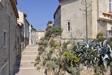 Typical alley in the old city of Antibes, commune is a Mediterranean resort in the Alpes-Maritimes department of southeastern France