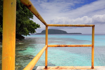 Cement pier-yellow metal railing. Champagne Beach-Espiritu Santo island-Vanuatu. 7401
