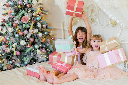 Two adorable girls with Christmas gifts
