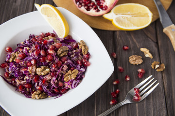 salad of red cabbage, pomegranate, apple and walnuts