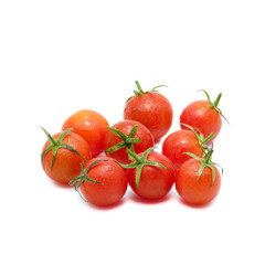 Tomatoes with water drops isolated on white background.