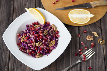 salad of red cabbage, pomegranate, apple and walnuts