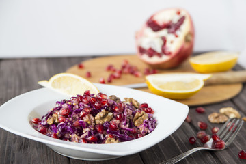 salad of red cabbage, pomegranate, apple and walnuts