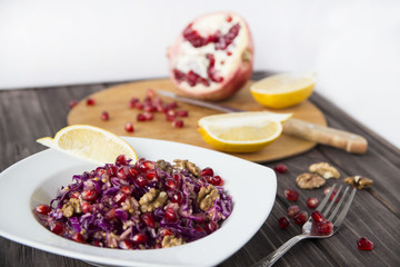salad of red cabbage, pomegranate, apple and walnuts