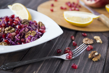 salad of red cabbage, pomegranate, apple and walnuts