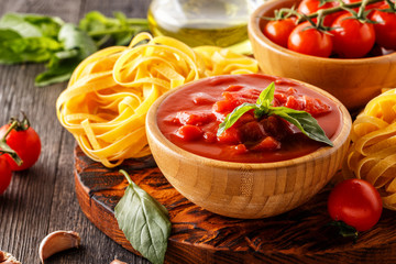 Products for cooking - tomato sauce, pasta, tomatoes, garlic.