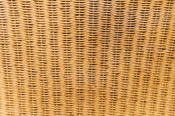 Close-up of the back of a chair made of rattan