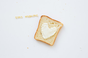 sandwich for breakfast in the form of heart with cheese - good morning inscription