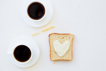 sandwich for breakfast in the form of heart with cheese - good morning sign and two coffee cups